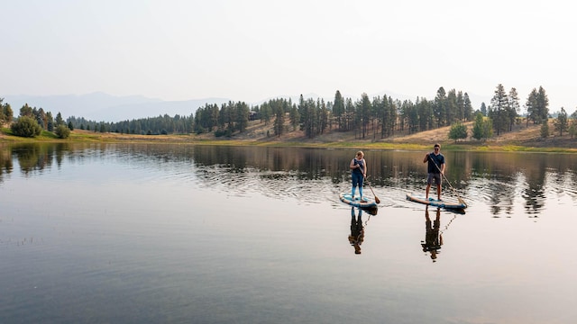 76 Rusty Iron Way, Eureka, MT 59917 - water view with a mountain backdrop and a heavily wooded area