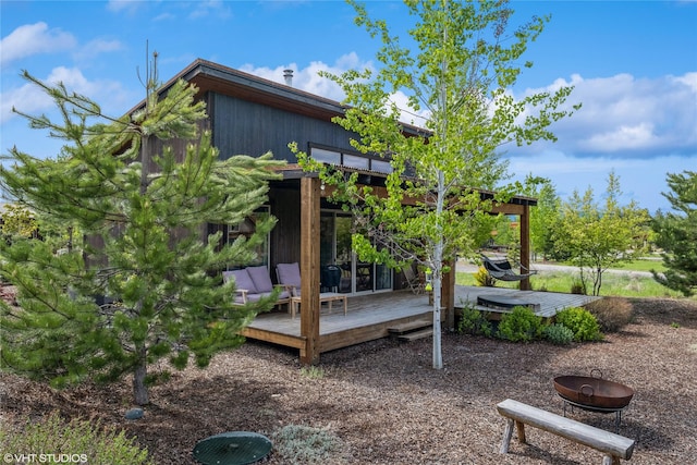 76 Rusty Iron Way, Eureka, MT 59917 - view of yard featuring a wooden deck and a fire pit