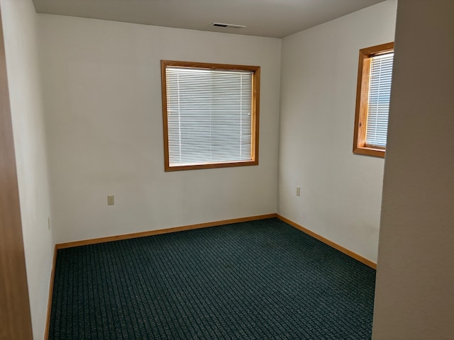 221 A St N Unit B6, Victor, MT 59875 - spare room featuring carpet floors and baseboards