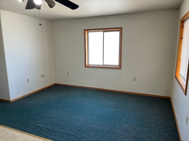 221 A St N Unit B6, Victor, MT 59875 - carpeted spare room with ceiling fan and baseboards