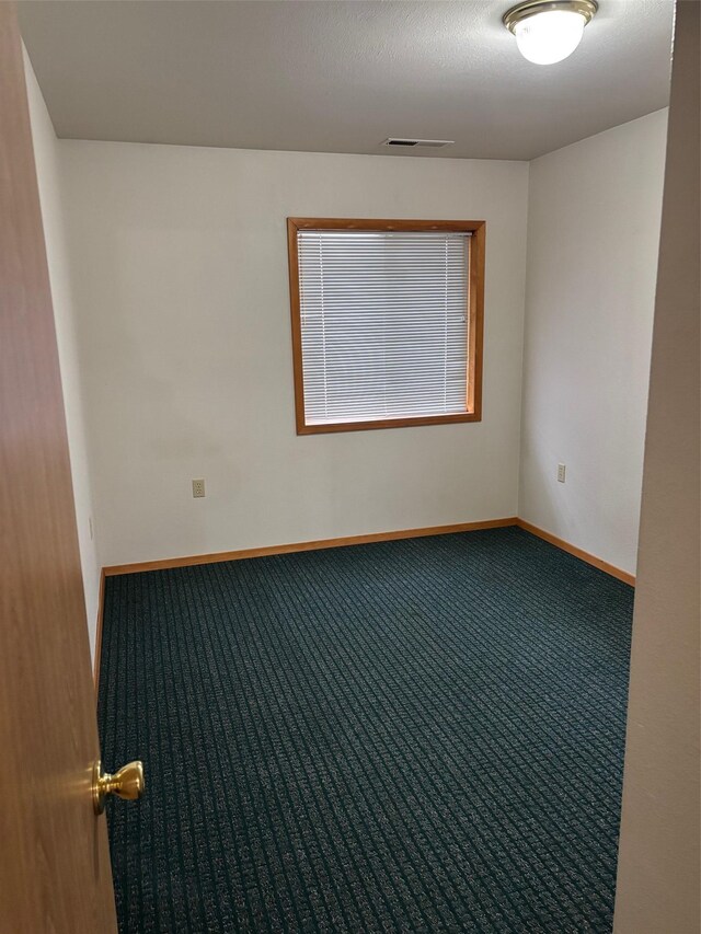 221 A St N Unit B6, Victor, MT 59875 - carpeted spare room with baseboards
