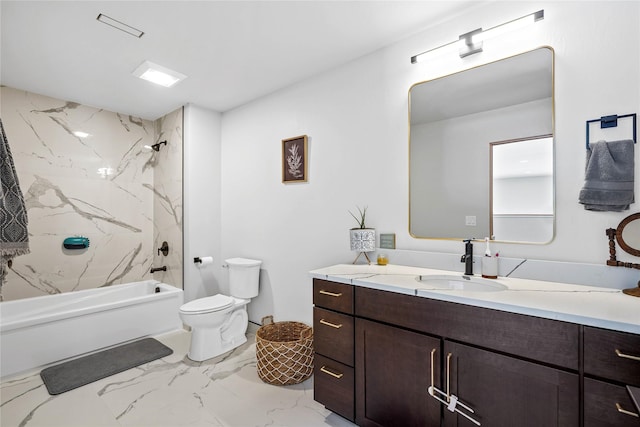 full bathroom with tiled shower / bath combo, vanity, and toilet