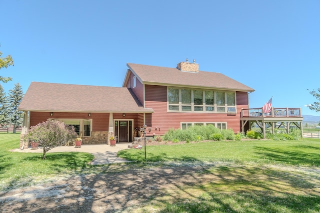 6809 N Montana Ave, Helena, MT 59602 - back of property with a yard, a chimney, a deck, and a patio