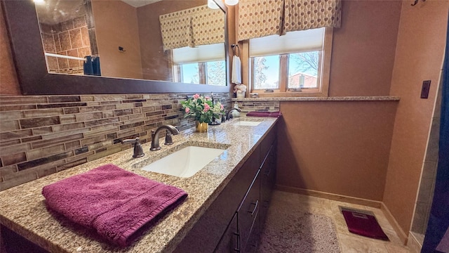 bathroom with sink and backsplash