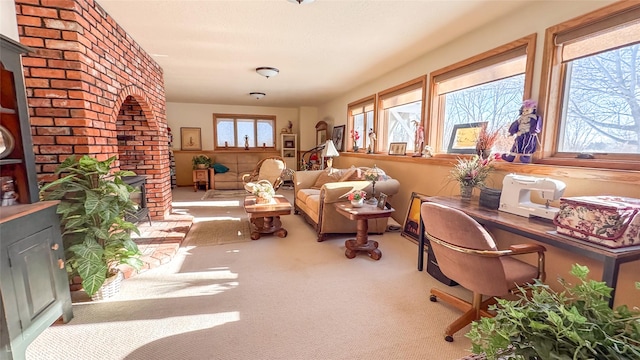 sunroom featuring a fireplace