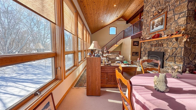 interior space with high vaulted ceiling, carpet, an AC wall unit, and wood ceiling