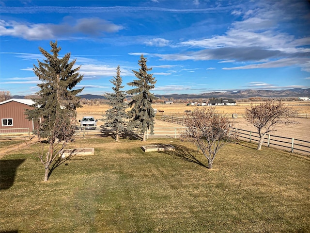 view of yard featuring a mountain view and a rural view