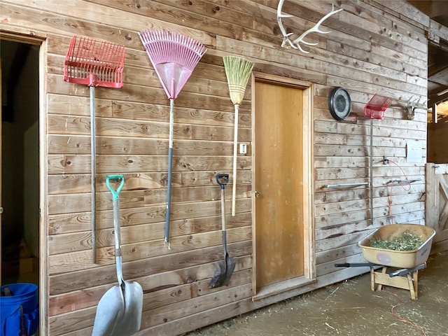 6809 N Montana Ave, Helena, MT 59602 - detailed view of wooden walls and unfinished concrete flooring