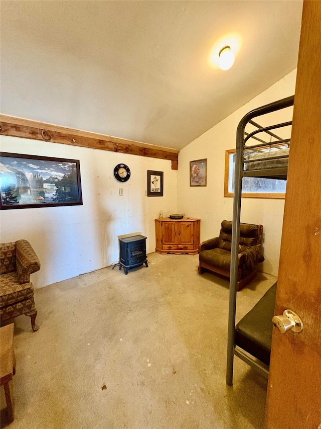 6809 N Montana Ave, Helena, MT 59602 - bedroom featuring a wood stove, lofted ceiling, and carpet floors