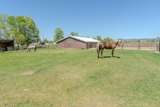 6809 N Montana Ave, Helena, MT 59602 - view of yard featuring an exterior structure, an outbuilding, and a rural view