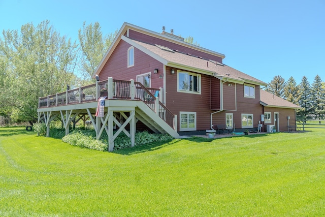 6809 N Montana Ave, Helena, MT 59602 - back of property with a deck, a yard, a shingled roof, and stairs