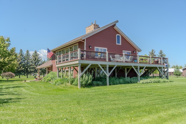6809 N Montana Ave, Helena, MT 59602 - rear view of house featuring a chimney, a wooden deck, and a yard
