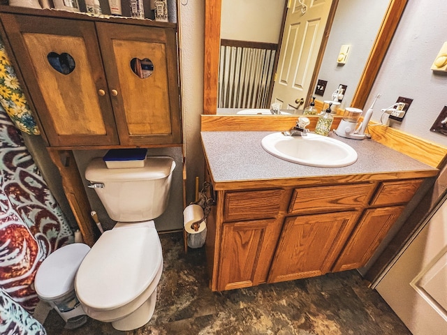 bathroom featuring vanity and toilet