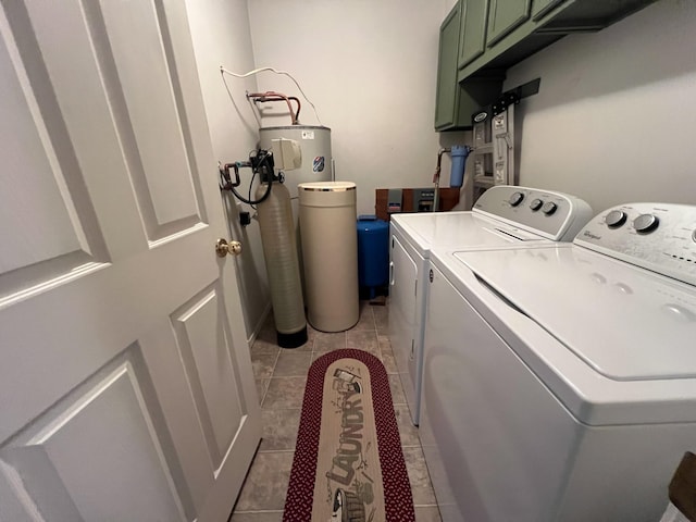 laundry area featuring cabinets, separate washer and dryer, electric water heater, and light tile patterned floors