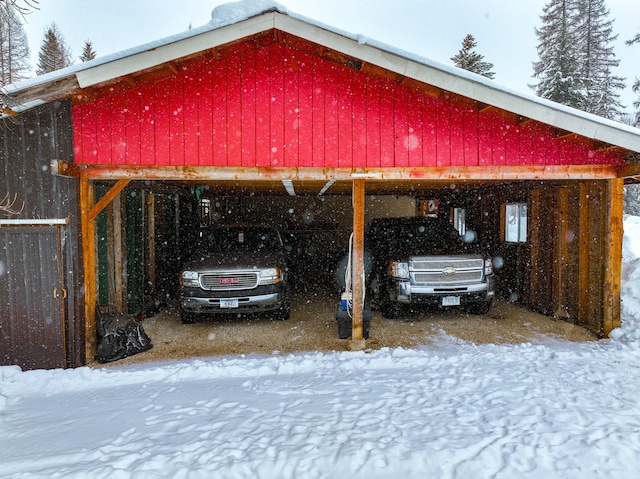 view of snow covered parking area