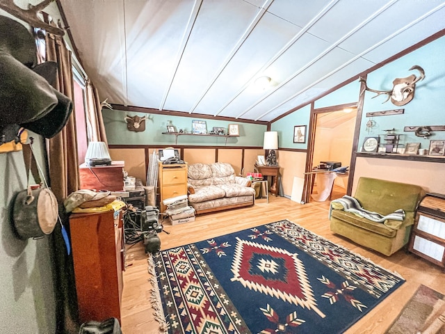 living room with lofted ceiling and hardwood / wood-style floors