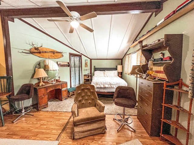 bedroom with vaulted ceiling with beams and hardwood / wood-style floors