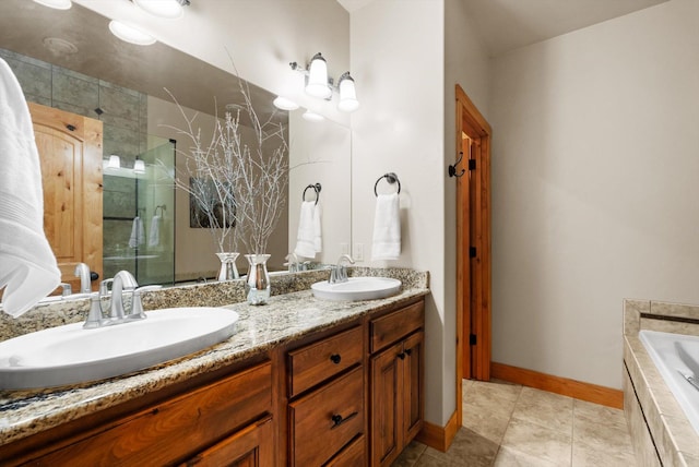 bathroom featuring a bath, a shower stall, double vanity, and a sink