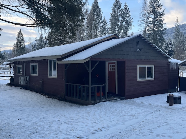 view of snow covered house