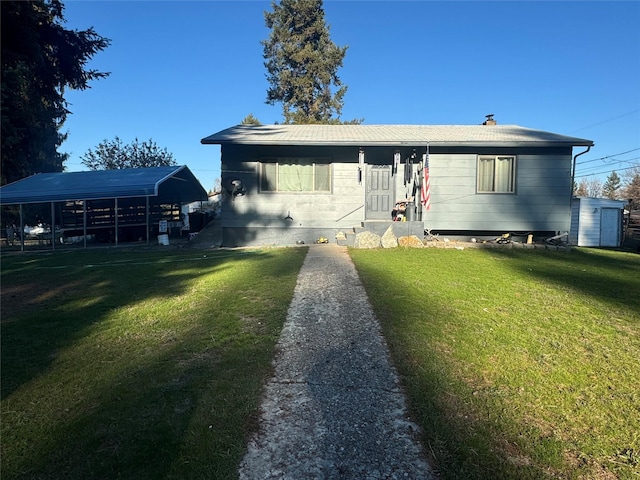 view of front facade featuring a carport and a front yard