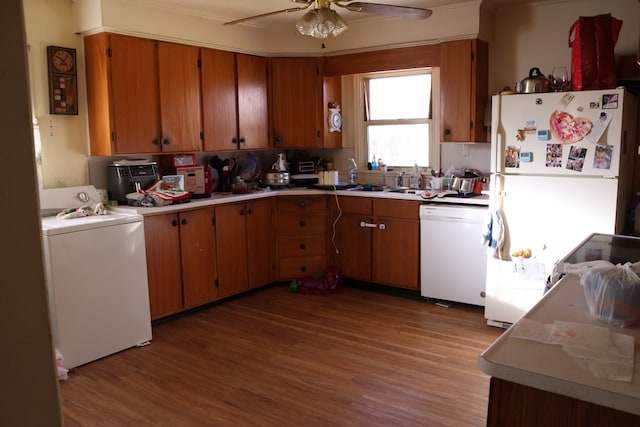 kitchen with washer / clothes dryer, ceiling fan, white appliances, and light hardwood / wood-style floors