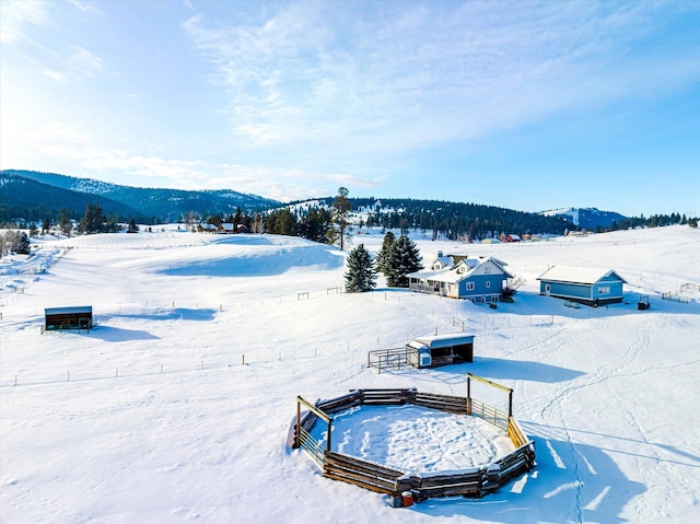 snowy aerial view with a mountain view