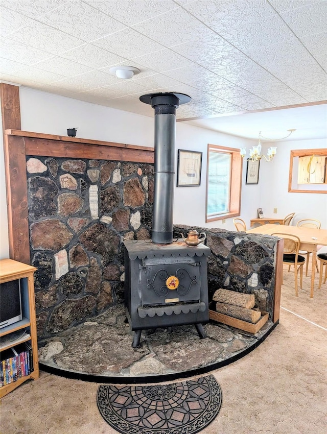 details featuring carpet and a wood stove