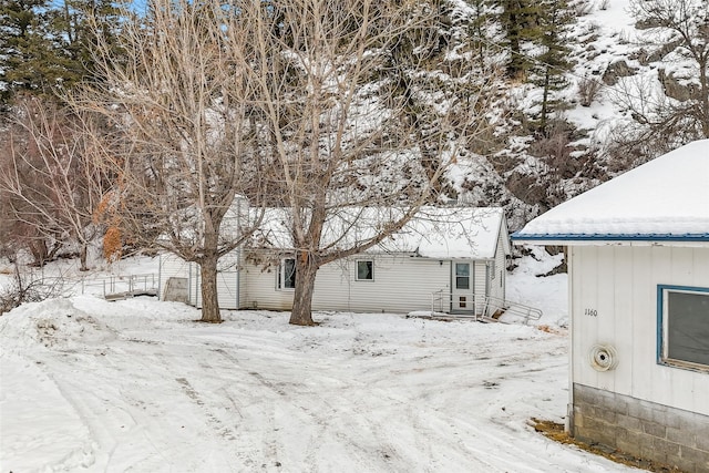 snowy yard with entry steps