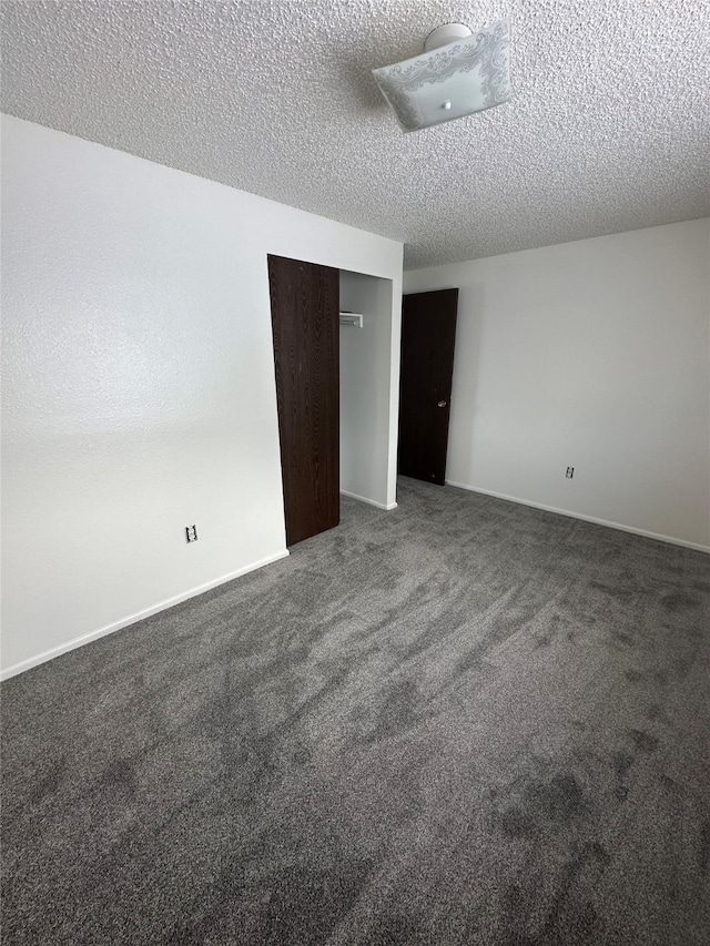 605 Idaho St, Deer Lodge, MT 59722 - unfurnished room featuring a textured ceiling and carpet