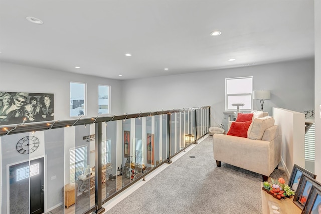 sitting room with a healthy amount of sunlight and carpet flooring