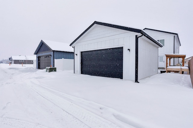 view of snow covered garage