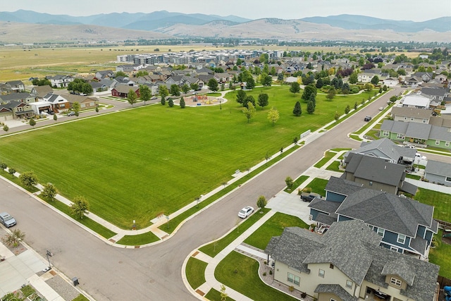 birds eye view of property featuring a mountain view