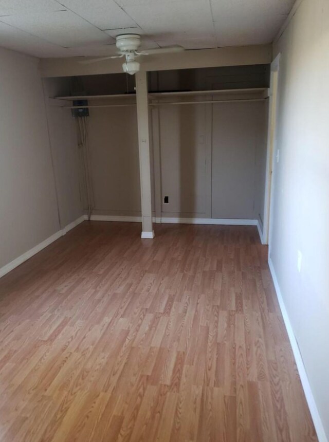 200 Cleveland Rd, Chinook, MT 59523 - unfurnished bedroom featuring light wood-style floors, baseboards, ceiling fan, and two closets