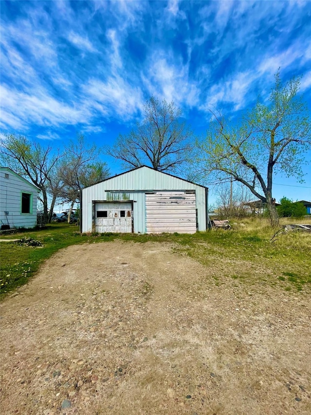 200 Cleveland Rd, Chinook, MT 59523 - detached garage featuring dirt driveway