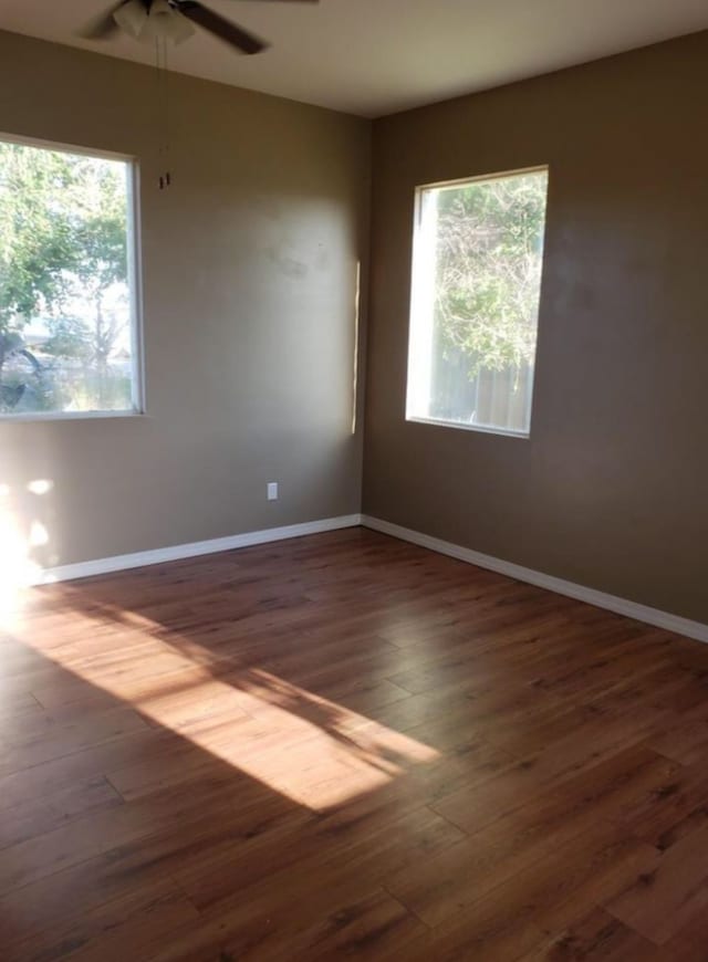 200 Cleveland Rd, Chinook, MT 59523 - spare room with a ceiling fan, wood finished floors, and baseboards