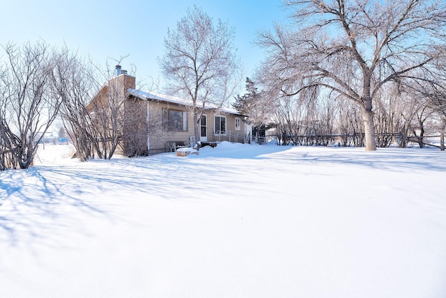 view of yard layered in snow