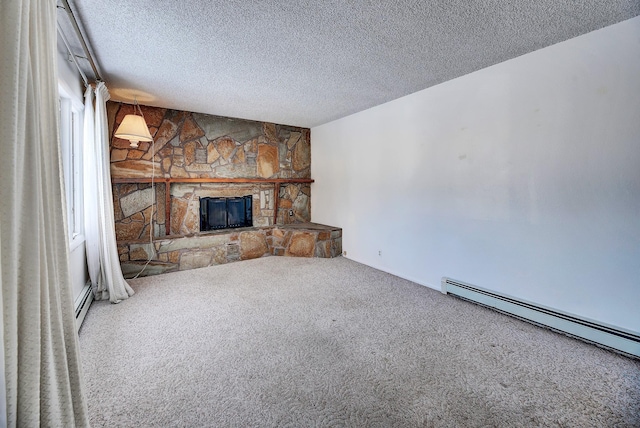 unfurnished living room featuring a baseboard heating unit, a stone fireplace, carpet floors, and a textured ceiling