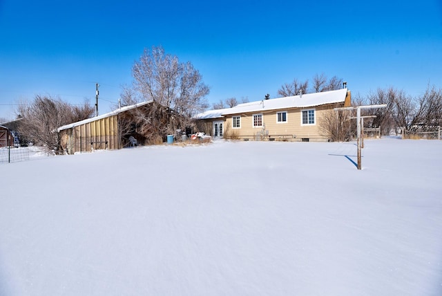 view of snow covered property