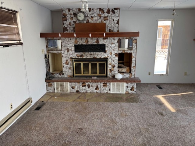 unfurnished living room with carpet floors, a paneled ceiling, a fireplace, and baseboard heating