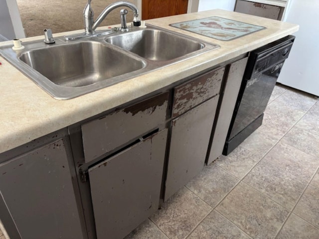 kitchen with black dishwasher, sink, and light tile patterned floors