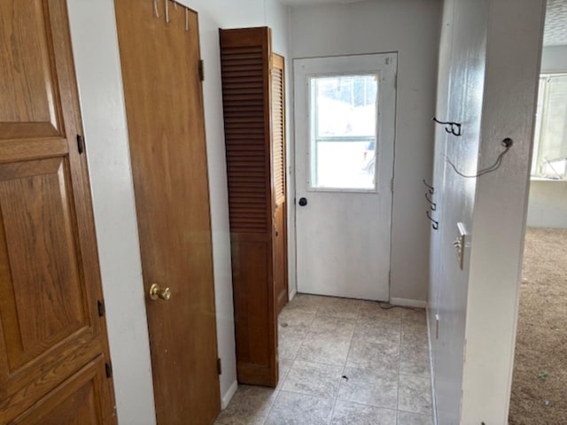 corridor with light tile patterned flooring