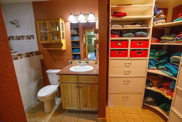 bathroom featuring tile patterned floors, toilet, and vanity