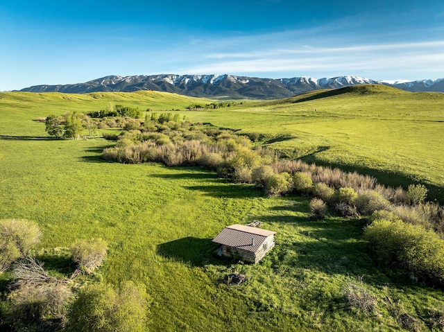 drone / aerial view featuring a mountain view and a rural view