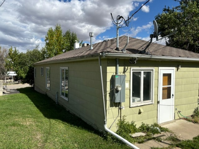 view of property exterior with a yard