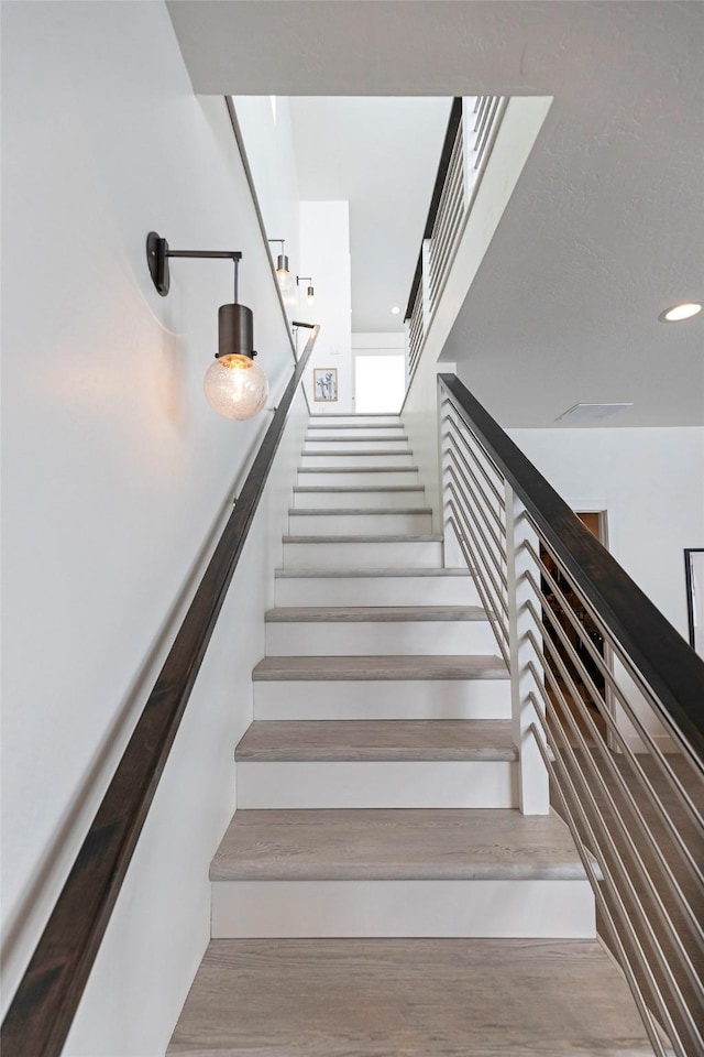 stairs with recessed lighting