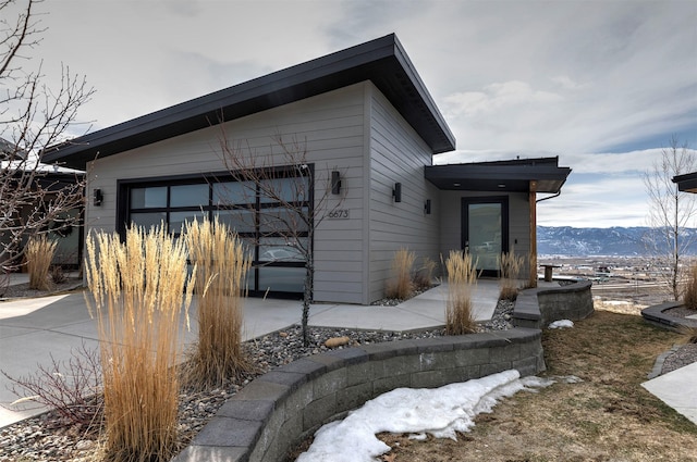 view of property exterior featuring a mountain view