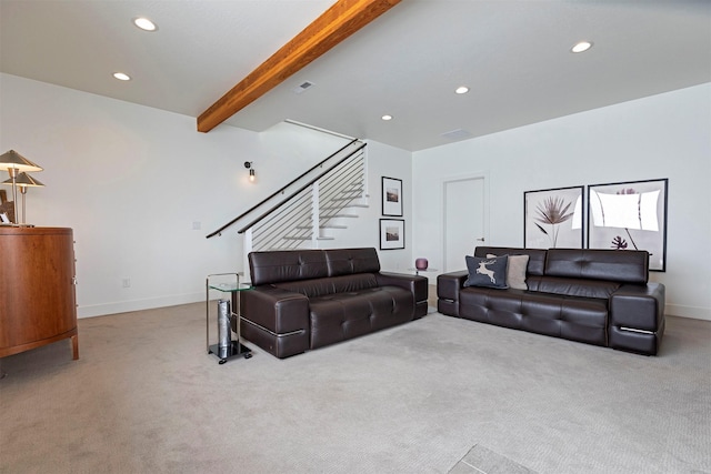 living room with light carpet and beam ceiling