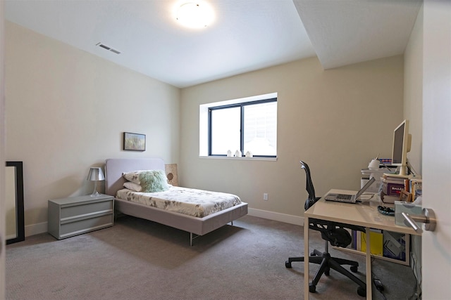 bedroom with carpet, visible vents, and baseboards