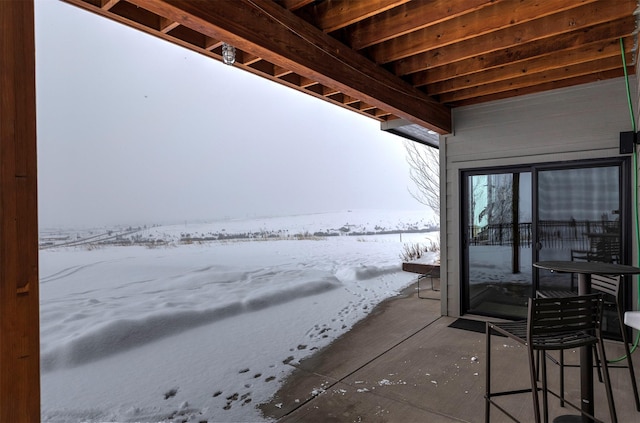 view of snow covered patio