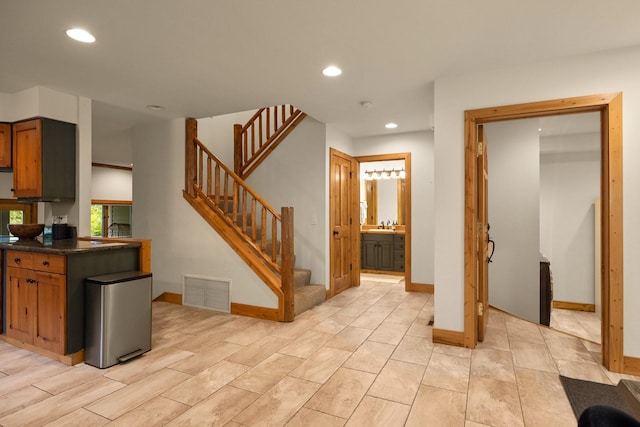 kitchen featuring sink and stainless steel fridge